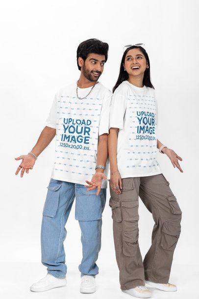 Oversized Tee Mockup of a Bearded and a Woman Posing in a Studio With Happy Looks