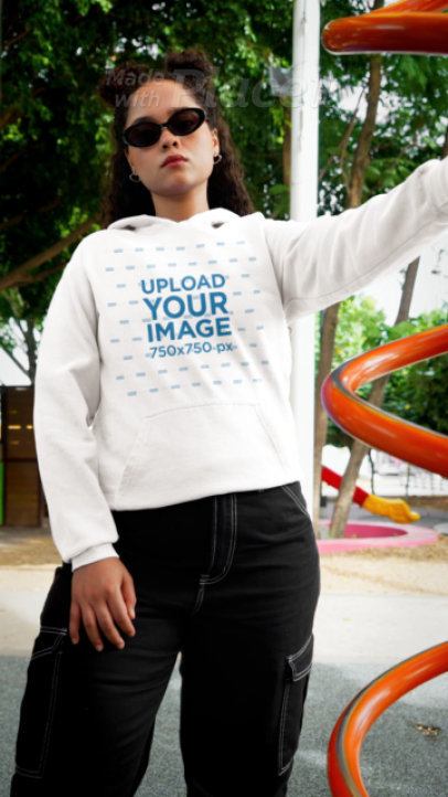 Comfort Colors Video of a Smiling Woman Wearing a Hoodie in a Playground 9074v