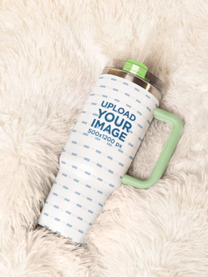 Mockup of a Stanley Tumbler Lying in a Cozy Blanket m54059