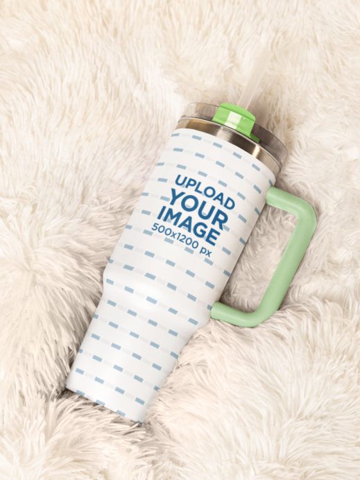 Mockup of a Stanley Tumbler Lying in a Cozy Blanket