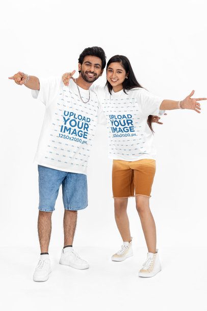 Oversized Round-Neck Tee Mockup Featuring a Cheerful Man and Woman Posing in a Studio