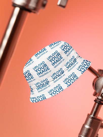 Mockup of a Sublimated Bucket Hat Hanging From a Stick m54274