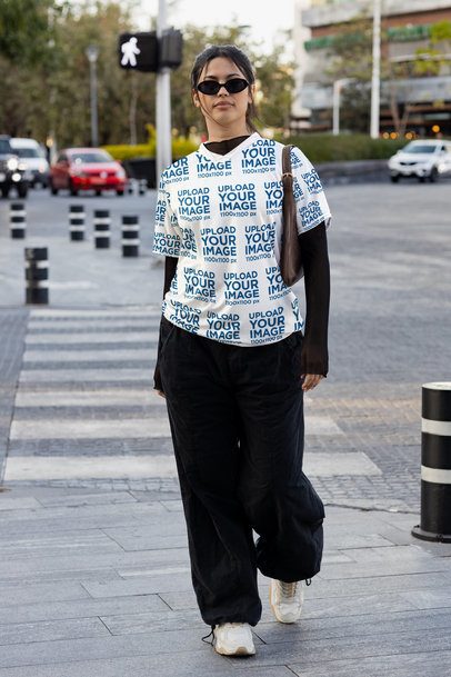 Sports Jersey Mockup Featuring a Woman Walking in the Street m54458