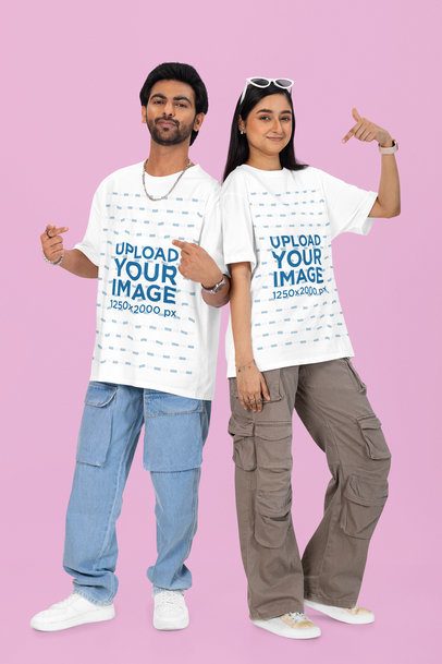 Oversized Tee Mockup of a Smiling Man and Woman Standing Against a Colorful Wall