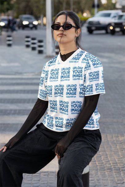 Sports Jersey Mockup of a Woman Posing on a Sidewalk m54459