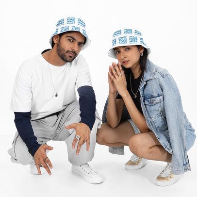 Bucket Hat Mockup Featuring a Man and a Woman Crouching in a Studio m53099