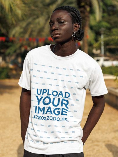 T-Shirt Mockup Featuring a Man With an Earring Posing With a Serious Look