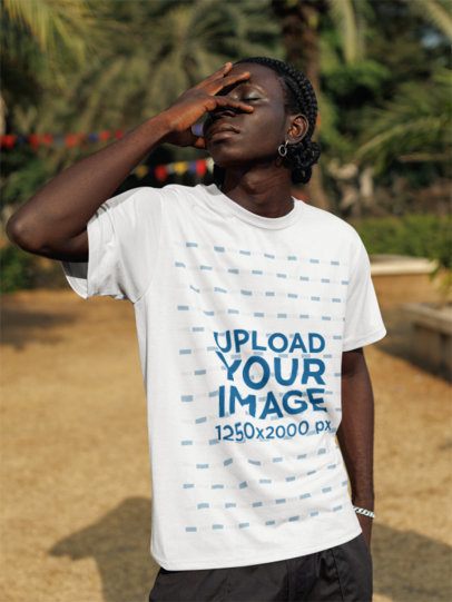 Round-Neck T-Shirt Mockup of a Man Posing With Eyes Closed and a Hand on His Face