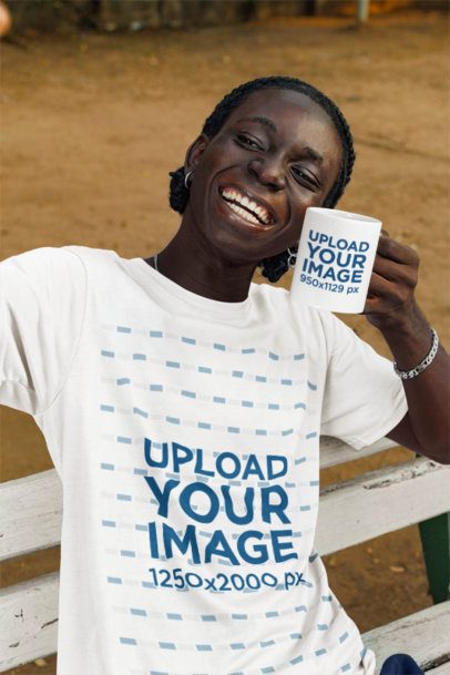 T-Shirt Mockup of a Joyful Man Showing an 11 Oz Coffee Mug