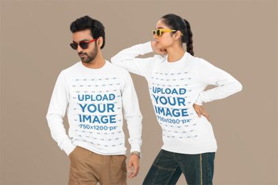 Bella Canvas Mockup of a Man and a Woman Wearing Long-Sleeve Tees and Sunglasses in a Studio
