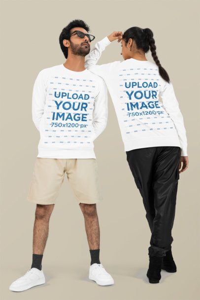Bella Canvas Long-Sleeve Tee Mockup Featuring a Cool Man Posing With a Woman in a Studio