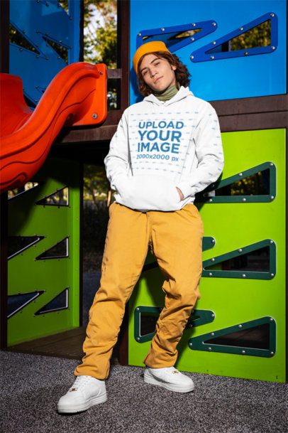 Comfort Colors Hoodie Mockup Featuring a Man Leaning on a Playground Game m53358