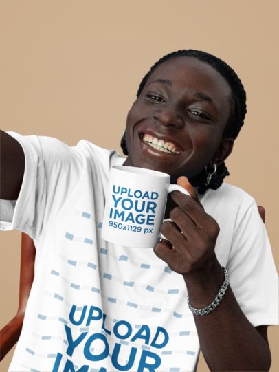 T-Shirt Mockup of a Happy Man Taking a Selfie While Holding an 11 Oz Coffee Mug