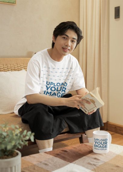 Oversized T-Shirt and Coffee Mug Mockup of a Man Reading in a Cozy Living Room