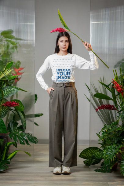Bella Canvas Long-Sleeve Tee Mockup of a Woman Posing With a Flower in a Garden m54644