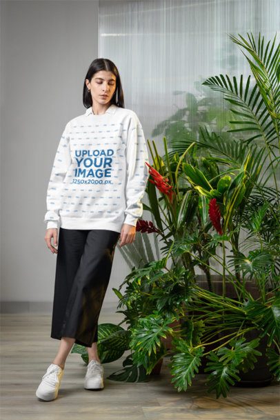 Comfort Colors Sweatshirt Mockup Featuring a Woman Standing Next to Some Plants m54645