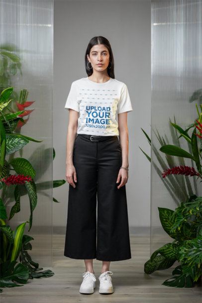 Mockup of a Woman Wearing a Bella Canvas Tee in a Room With Plants m54669