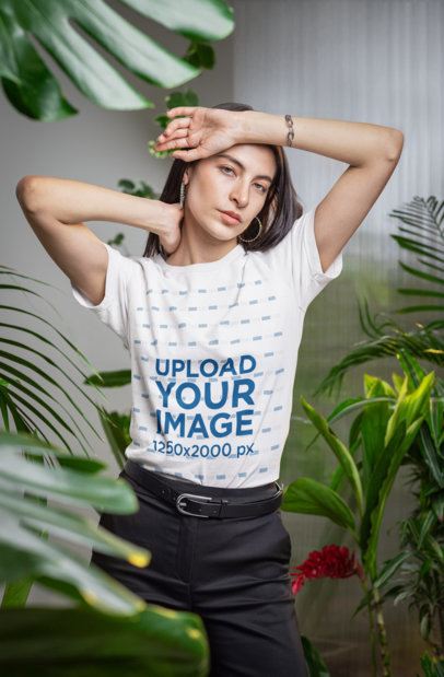 Bella Canvas Tee Mockup Featuring a Woman Posing Near Some Plants in a Secret Garden-Inspired Set m54671