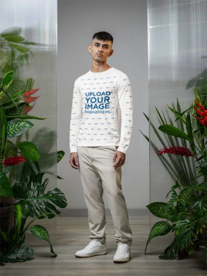 Bella Canvas Long-Sleeve Tee Mockup Featuring a Man in a Room With Plants m54664
