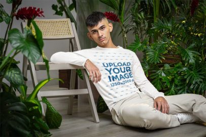 Bella Canvas Long-Sleeve Tee Mockup Featuring a Man in a Room With Plants m54665