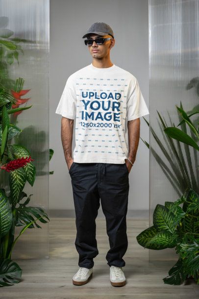 Oversized T-Shirt Mockup Featuring a Man With Sunglasses Posing With Plants m54654