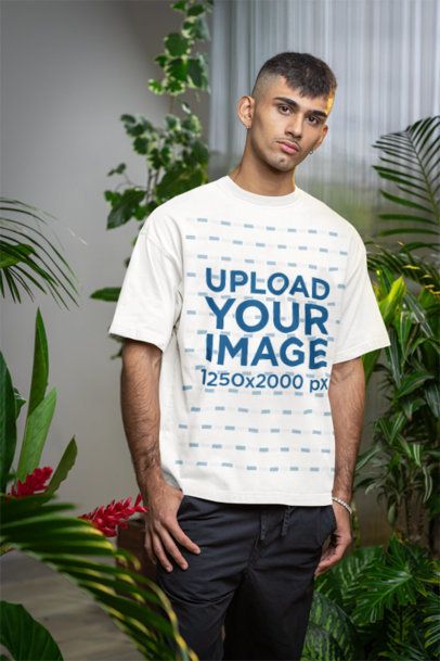 Secret Garden-Inspired Mockup Featuring a Man Wearing an Oversized T-Shirt