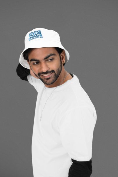 Bucket Hat Mockup Featuring a Smiling Bearded Man Standing Against a Customizable Background