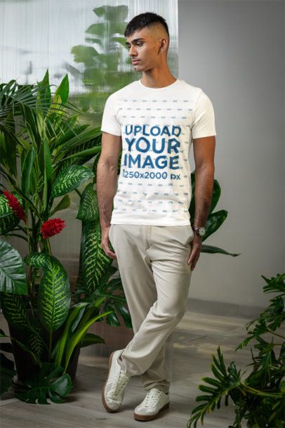 Bella Canvas T-Shirt Mockup of a Man Posing in a Secret Garden-Inspired Setting m54658