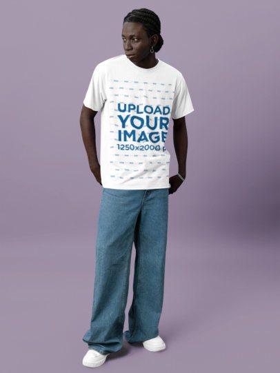 Round-Neck T-Shirt Mockup Featuring a Man Standing With a Serious Look in a Studio