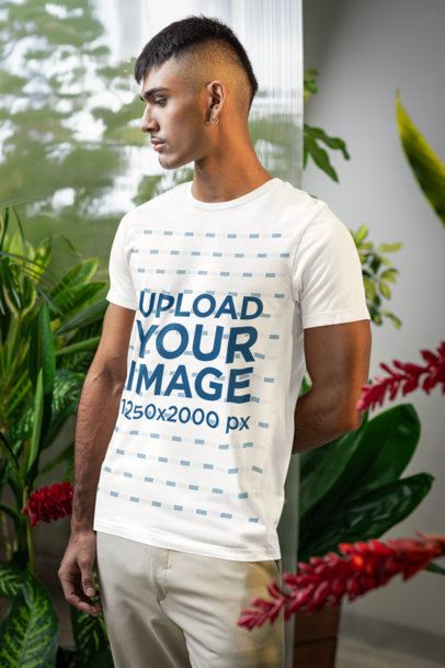 Bella Canvas T-Shirt Mockup Featuring a Man Standing in a Secret Garden-Inspired Setting m54659