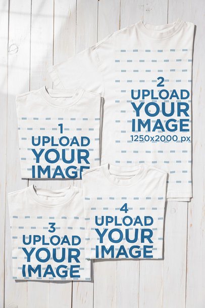 Mockup of Four Oversized T-Shirts Placed on a Wooden Floor m54927