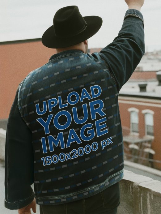 Back-View Mockup of an AI-Generated Man in a Balcony Wearing an Embroidered Denim Jacket