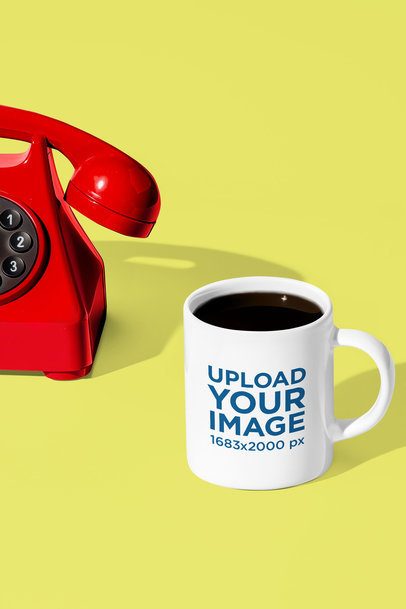 Mockup of an AI-Generated Coffee Mug Placed on a Colorful Setting With a Vintage Telephone m54800