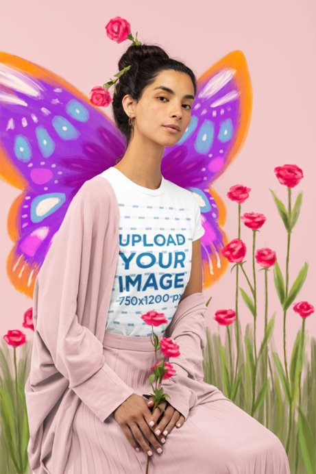 T-Shirt Mockup Featuring a Woman With Illustrated Flowers and Butterfly Graphics in the Background