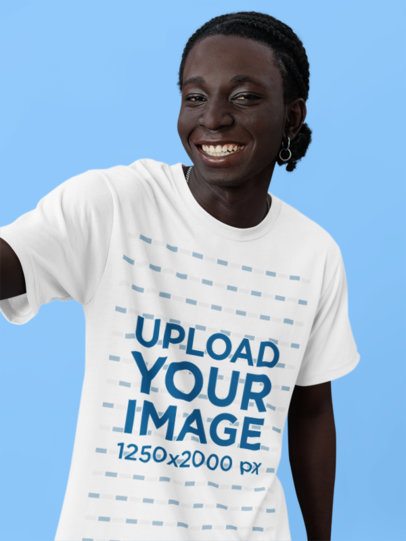 Round-Neck T-Shirt Mockup of a Smiling Man Taking a Selfie in a Studio