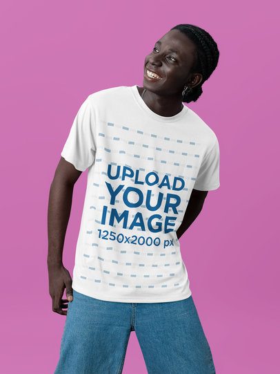 T-Shirt Mockup Featuring a Joyful Man Standing Against a Customizable Background