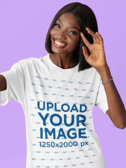 Round-Neck T-Shirt Mockup Featuring a Cheerful Woman in a Studio Taking a Selfie