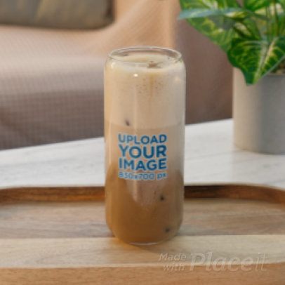 Video of a Can Glass Filled With an Ice Latte Placed on a Table