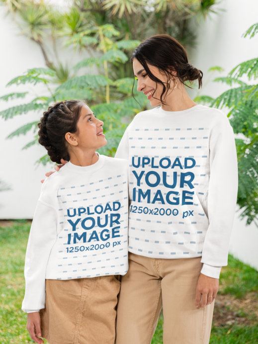Gildan and Comfort Colors Mockup of a Happy Mom With Her Daughter Wearing Sweatshirts for a Mother's Day Garden Party