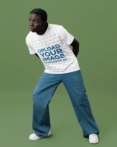 Round-Neck T-Shirt Mockup Featuring a Man With a Thoughtful Look in a Studio