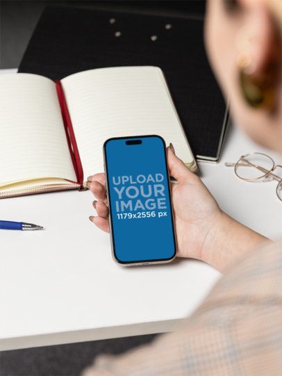 Corporate-Themed Mockup of a Woman Holding an iPhone 16 m55719