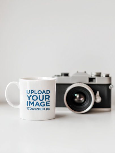 Mockup of an AI-Generated Coffee Mug Placed on a Setting With a Vintage Camera m54813