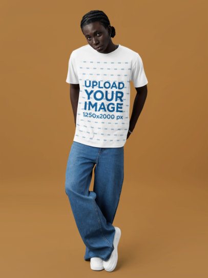 T-Shirt Mockup Featuring a Serious Man Posing Against a Customizable Background