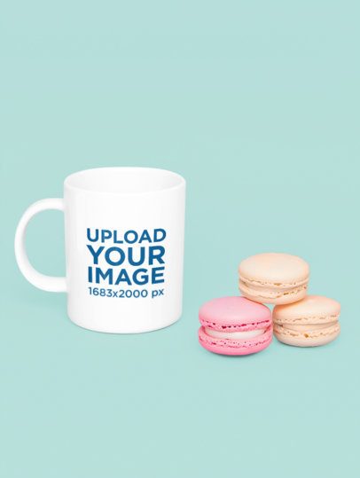 Mockup of an AI-Generated Coffee Mug Placed on a Colorful Surface With Two Macaroons m54810