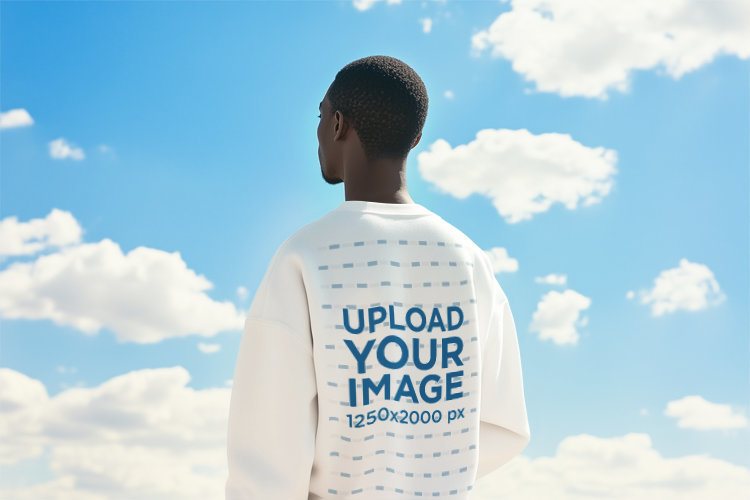 AI-Generated Mockup of the Back-View of a Man in a Sweatshirt Standing Against the Sky