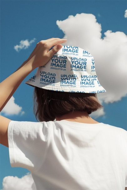 Back-View Mockup of an AI-Generated Woman Wearing a Bucket Hat While Looking at the Sky
