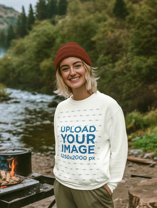 Sweatshirt Mockup Featuring an AI-Created Happy Woman Cooking Outdoors