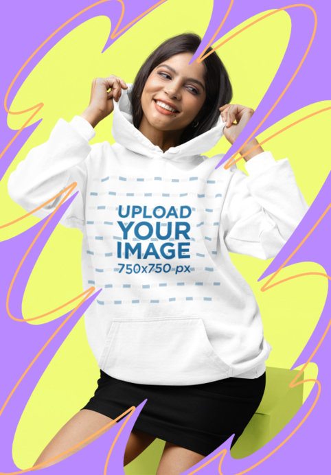 Comfort Colors Hoodie Mockup Featuring a Happy Woman and Colorful Background With Shapes