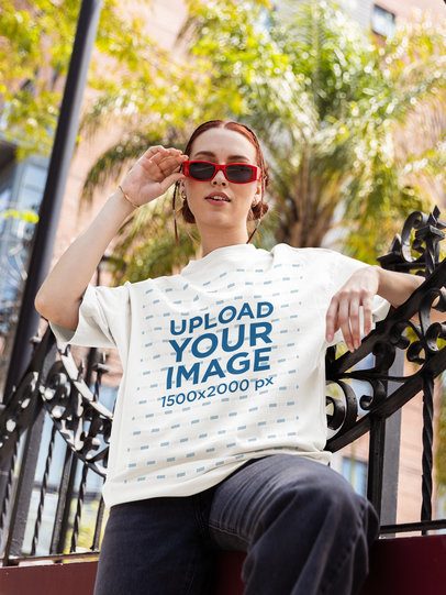 Oversized Tee Mockup of a Cool Woman With Sunglasses Posing in the Street