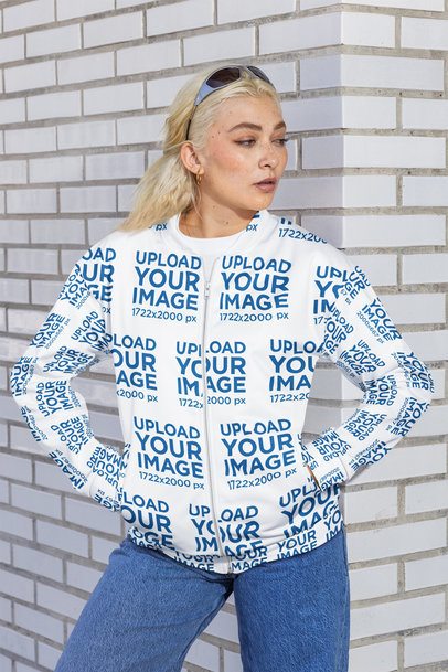 Bomber Jacket Mockup Featuring a Woman With Jeans Posing Against a Brick Wall m56000